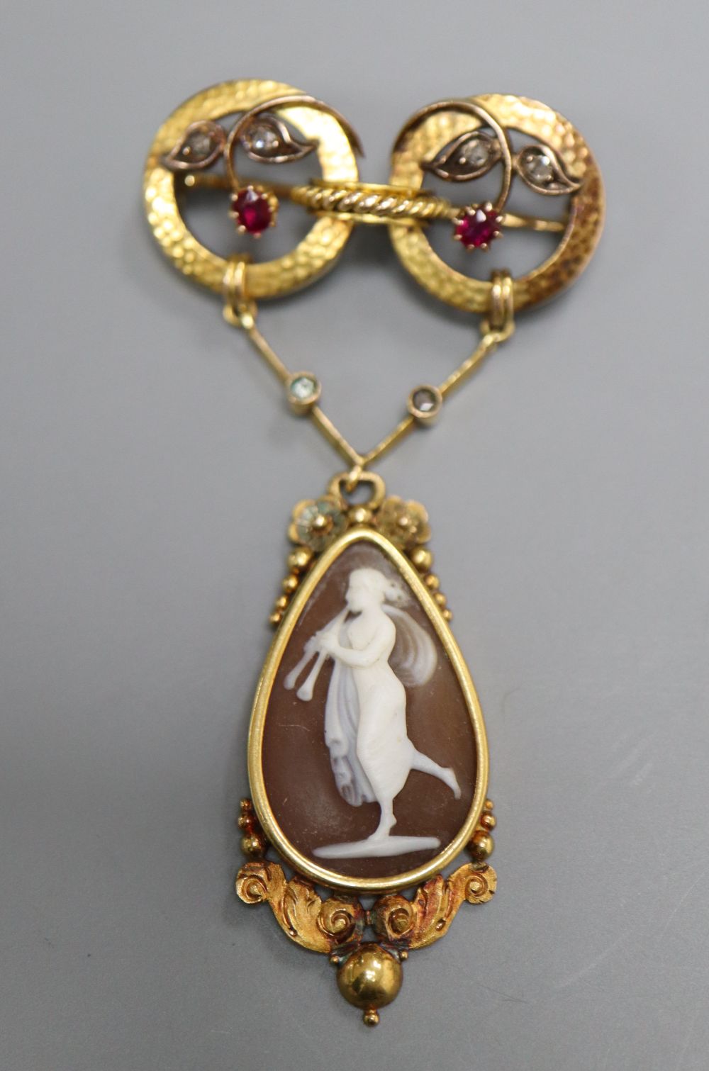 A Victorian yellow metal, ruby, rose cut diamond and carved cameo shell set drop pendant brooch, 61mm, gross 8 grams,